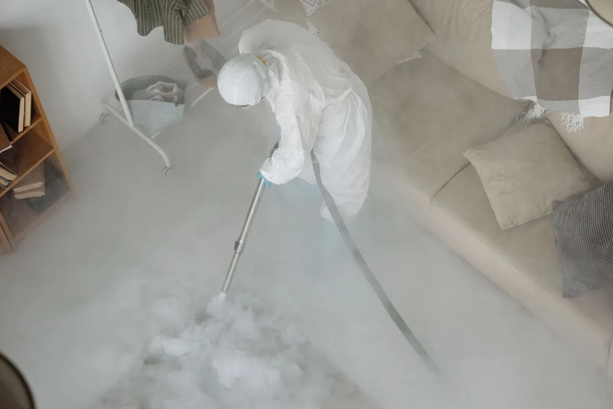 Biohazard cleanup technician in protective equipment, Cornerstone Village, Santa Ana, CA
